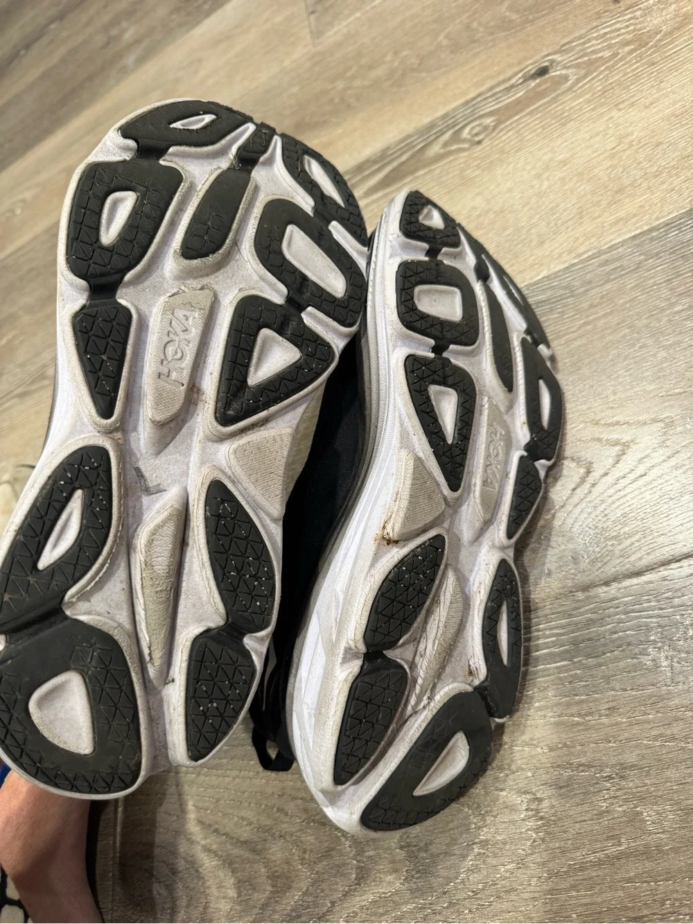 Hoka One One Bondi 8 running shoes feature a black upper and a white midsole